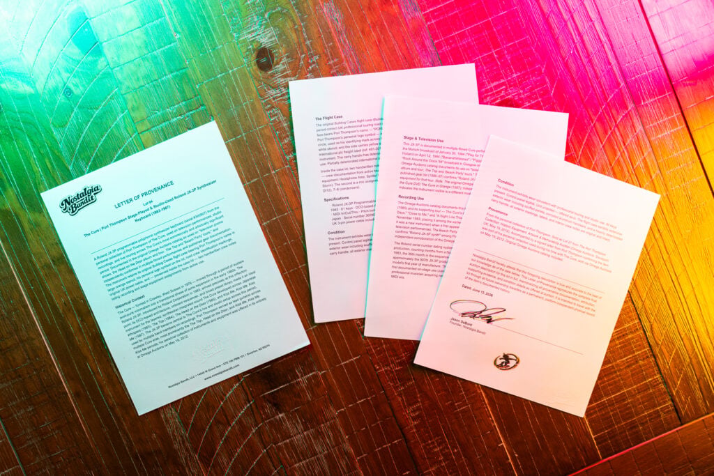 Letter of Provenance for Authenticity - Four pages spread on a table with colored lighting the first on letterhead and the last page signed with mascot logo.