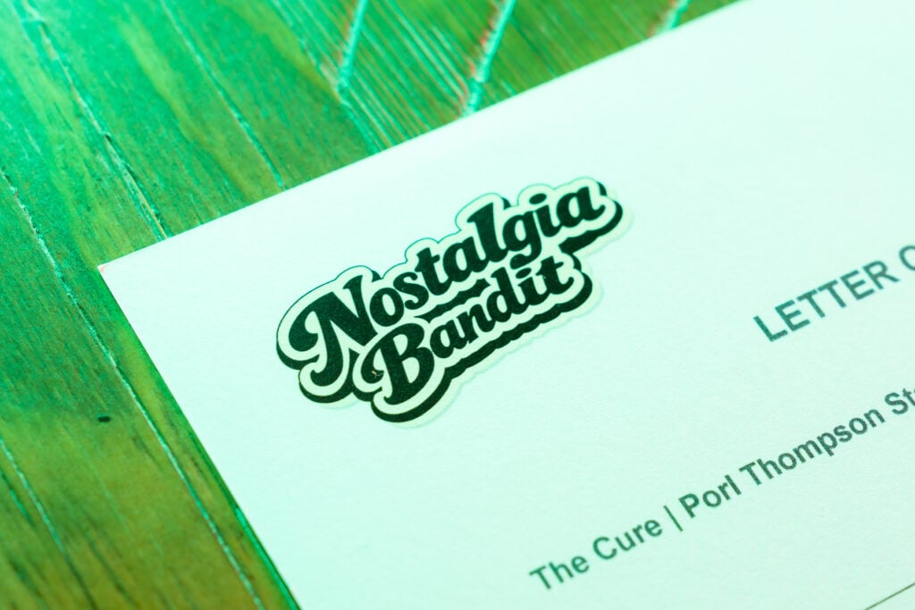 Letter of Provenance for Authenticity - upper corner of one sheet showing Nostalgia Bandit logo